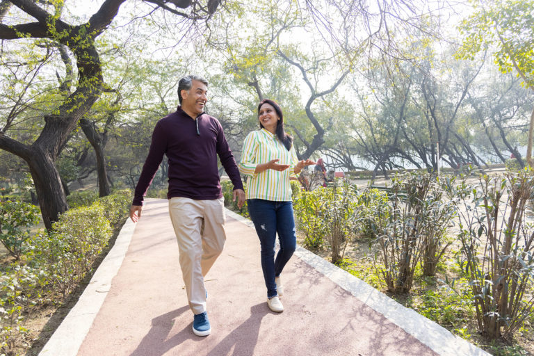 Couple having fun while admiring view at park